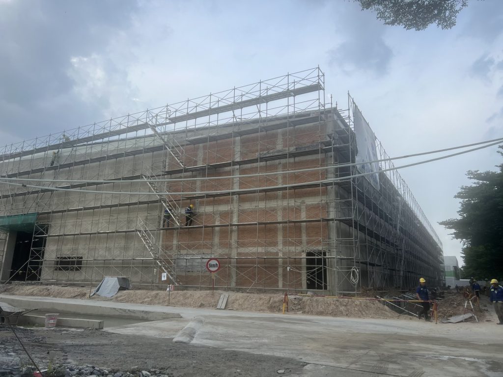 Scaffolding around the building during external masonry and plastering