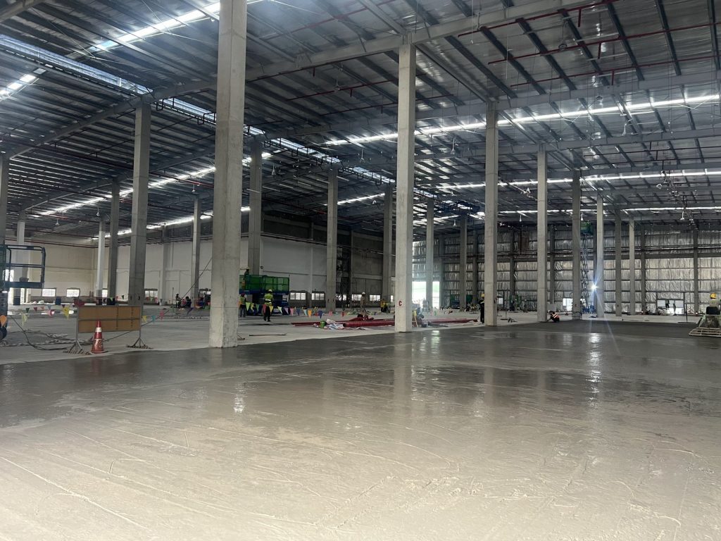 Finished concrete floor with lighting and roof structure installed